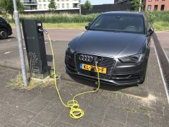 Almere, Netherlands - May 27, 2018: Audi A3 Sportback E-Tron electric car being charged at a Allego charge point.