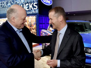 Volkswagen CEO Dr. Herbert Diess (right) and Ford CEO Jim Hackett. ...