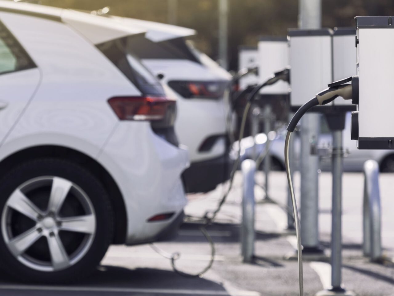 A parking lot with charging stations for electric cars. ...